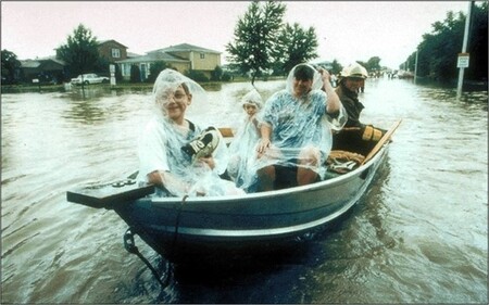 firemen rescue residents from floodwaters on the west side of Aurora during the July 1996 flood