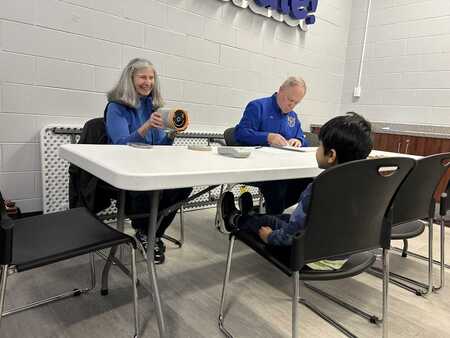 Aurora Lions Club members Susan Koepke, left, and Jay Short screen a youth's vision in January at Fox Valley Park District's Eola Community Center. A total of 178 children were screened in two months. (FVPD photo)