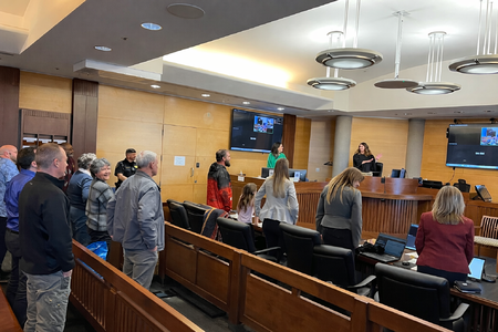 Tim M. receives congratulations from Kane County Judge Christine Downs.