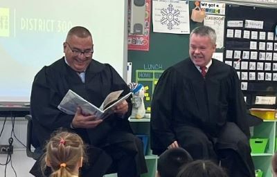 Kane County Chief Judge Clint Hull and Judge Julio Cesar Valdez read to students at Dundee Highlands Elementary School in West Dundee. 