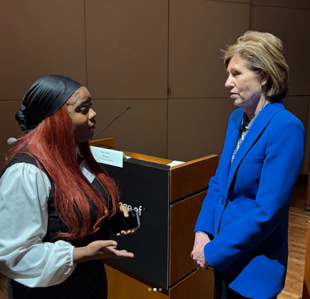 Justice Elizabeth Rochford of the Illinois Supreme Court talks with student. Photo Credit - IJA Instagram 
