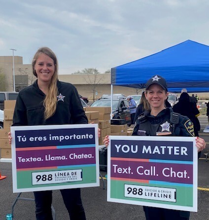 988 Suicide and Crisis Lifeline signs and other material given away during event 