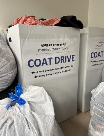 Box full of donations for cold weather clothing drive 