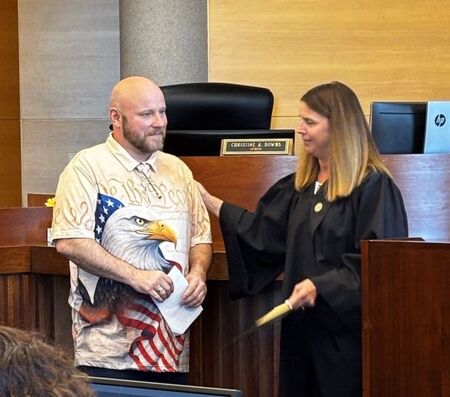 Robert Lundquist with Judge Christine Downs during Veterans Treatment Court graduation 