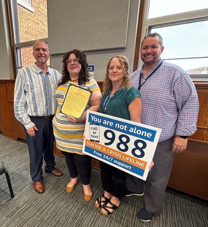 Board Member Bill Tarver, Stephanie Dewinski of Suicide Prevention Services, Tina Koral and Michael Isaacson with the Kane County Health Department 