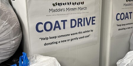Box full of donations for cold weather clothing drive 