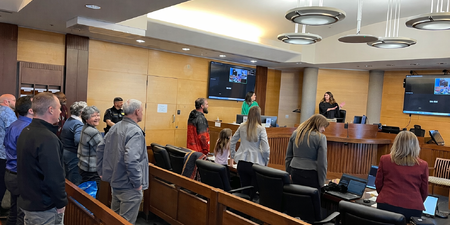 Tim M. receives congratulations from Kane County Judge Christine Downs.