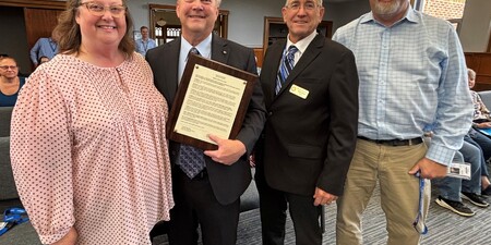 Tracy Erickson, Gary Erickson, Board Member Chris Kious, IT Executive Director Roger Fahnestock 