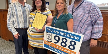 Board Member Bill Tarver, Stephanie Dewinski of Suicide Prevention Services, Tina Koral and Michael Isaacson with the Kane County Health Department 
