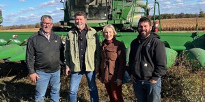 Kane County Board Chairman Corinne Pierog meets with Farmers Steve and Dale Pitstick during a harvest in a cornfield in Hamsphire 