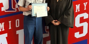 Santiago Garcia (Junior, 2nd Place) left, with Judge Kimberly DiGiovanni, and Kane County Bar Foundation President Katie Doyen (not pictured) at Marmion Academy — Santiago receives his $250 check, Law Day swag bag, and certificate. Photo provided by Katie